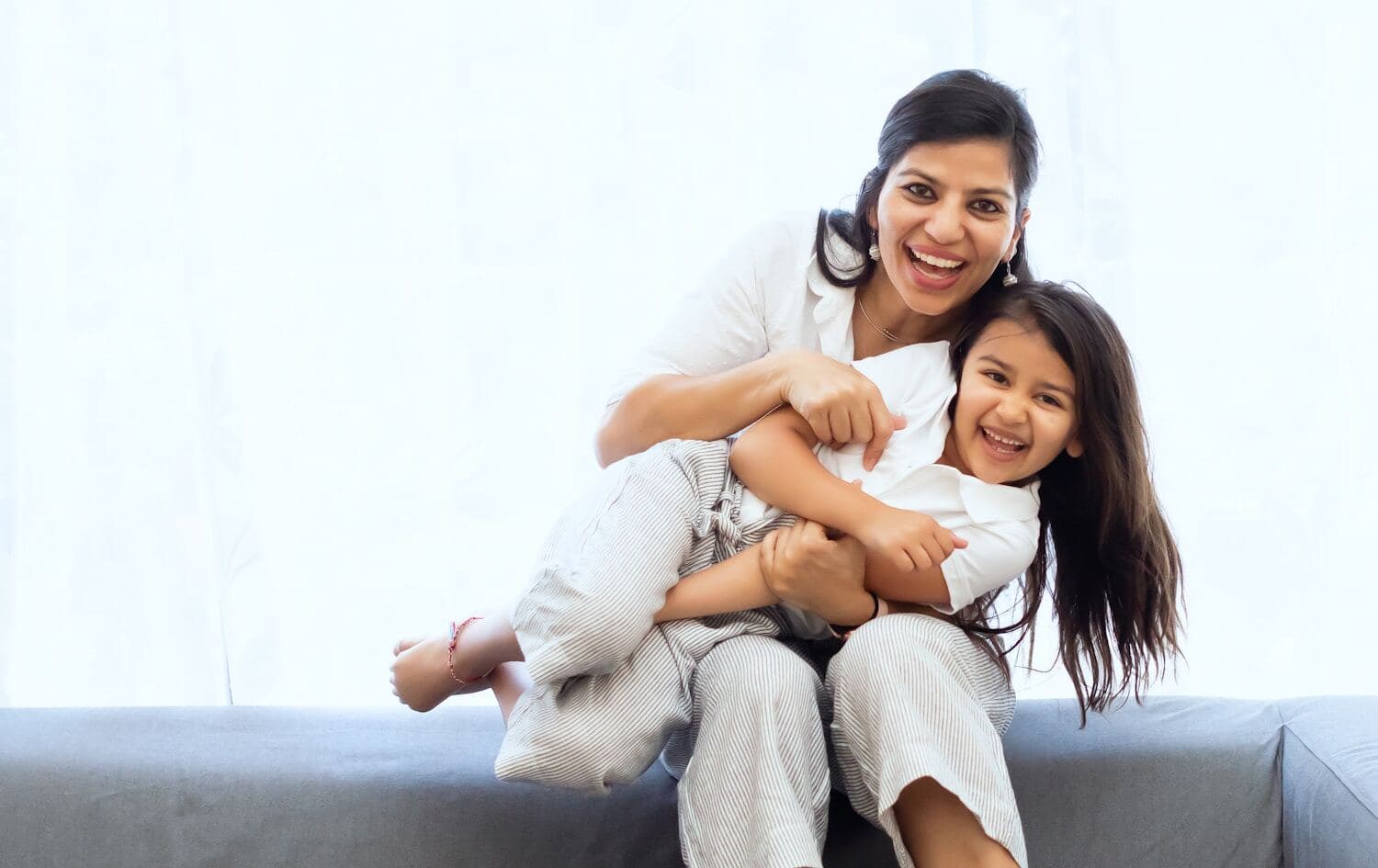 A joyful mother and daughter